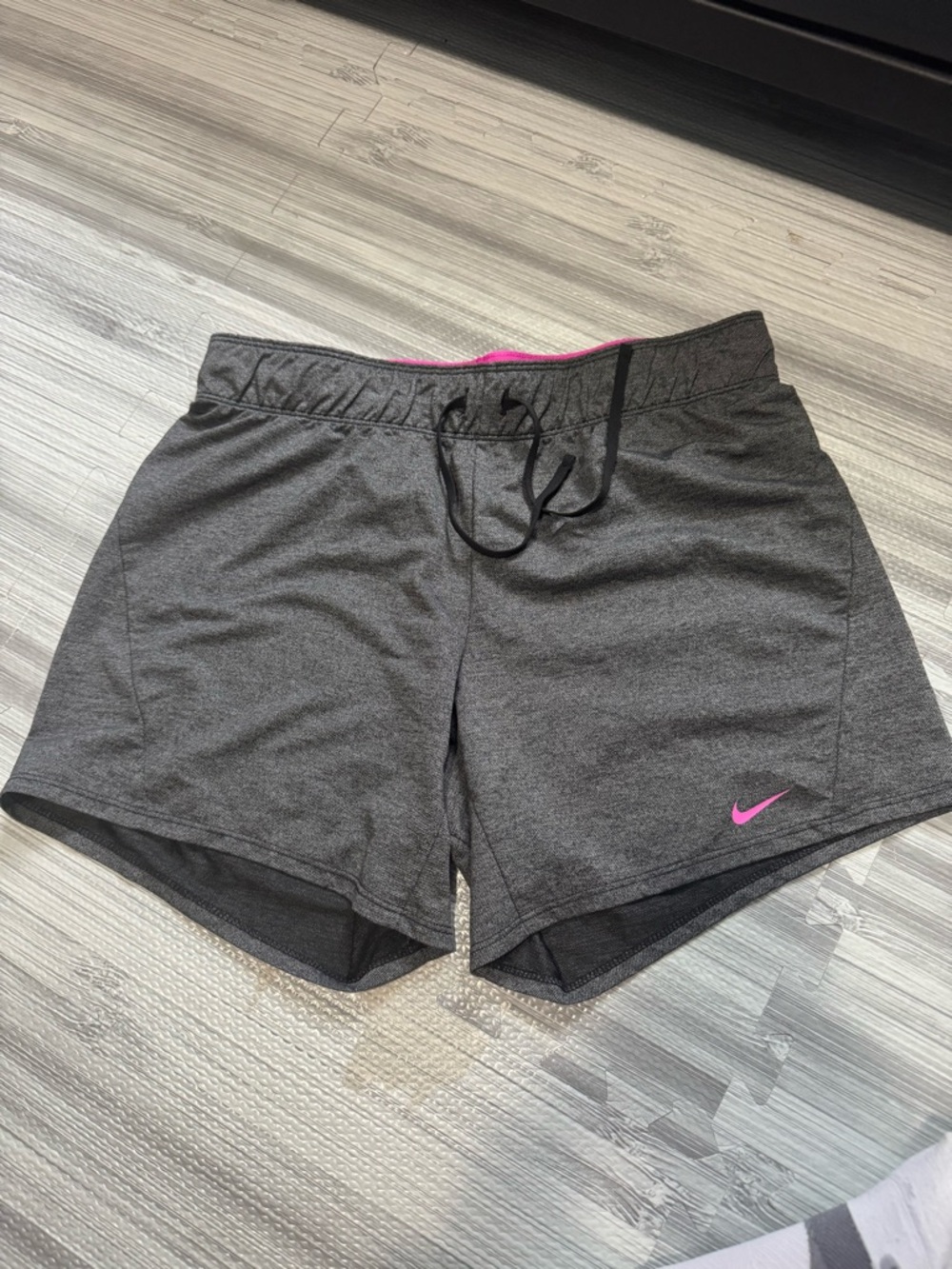 Nike Women's Dark Gray Athletic Shorts with Pink Swoosh
